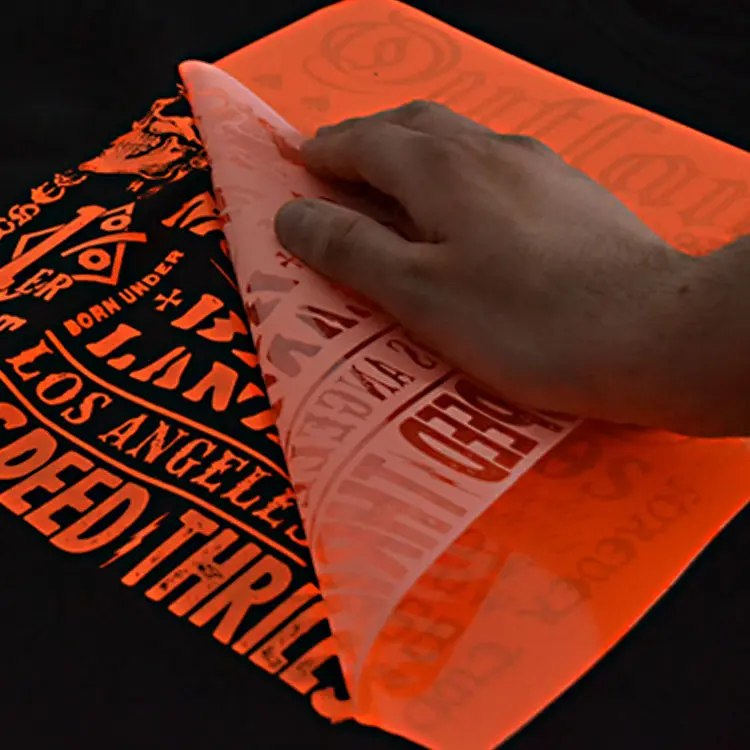 Heat-transfer vinyl being peeled from a printed t-shirt